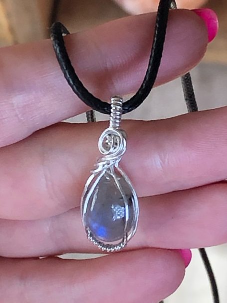 A moonstone pendant wrapped in silver